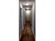 Bright hallway with wood-look flooring and neutral walls at 115 Elberta St, Mcdonough, GA 30253