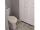 Small half bathroom with toilet and pedestal sink at 115 Elberta St, Mcdonough, GA 30253