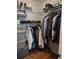 Organized walk-in closet with hanging rods and shelves at 115 Elberta St, Mcdonough, GA 30253