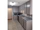 Updated kitchen with gray cabinets and stainless steel appliances at 115 Elberta St, Mcdonough, GA 30253