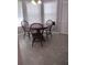 Charming dining area with wood table and chairs at 115 Elberta St, Mcdonough, GA 30253