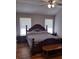 Spacious bedroom with king-size bed and wood flooring at 115 Elberta St, Mcdonough, GA 30253