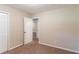 Spacious bedroom with carpet, door to another room, and large closet at 8596 Timberlane Dr, Douglasville, GA 30134