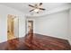 Hardwood floor bedroom with access to bathroom and hallway at 390 17Th Nw St # 5005, Atlanta, GA 30363