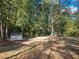 Spacious backyard with shed and wooded area at 3563 Denby Dr, Snellville, GA 30039