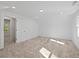 Large bedroom featuring neutral carpeting and ample natural light at 3563 Denby Dr, Snellville, GA 30039