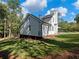 Newly renovated home with white siding, deck and large backyard at 3563 Denby Dr, Snellville, GA 30039