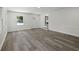 Open concept living room with gray floors and access to another room at 3563 Denby Dr, Snellville, GA 30039