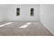 Bright and airy bedroom with neutral carpeting and large windows at 3563 Denby Dr, Snellville, GA 30039