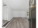 Bright and spacious living area with gray vinyl flooring and an open floor plan at 3563 Denby Dr, Snellville, GA 30039