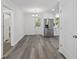 Modern dining room featuring hardwood floors and an adjacent kitchen at 3563 Denby Dr, Snellville, GA 30039