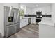 Modern kitchen with stainless steel appliances and white cabinets at 3563 Denby Dr, Snellville, GA 30039