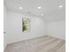 Bright bedroom with neutral carpet and a window offering natural light at 3563 Denby Dr, Snellville, GA 30039