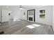 Spacious living area with fireplace, hardwood floors and plenty of natural light at 3563 Denby Dr, Snellville, GA 30039