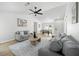 Bright living room featuring hardwood floors, neutral color palette, and ample seating at 11310 Ridge Hill Dr, Alpharetta, GA 30022