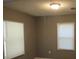 Bright bedroom with two windows and neutral walls at 890 Mcwilliams Se Rd, Atlanta, GA 30315