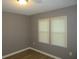 Spacious bedroom with two windows, neutral walls, and wood-look flooring at 890 Mcwilliams Se Rd, Atlanta, GA 30315