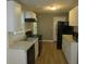 Galley kitchen with white cabinets and black appliances at 890 Mcwilliams Se Rd, Atlanta, GA 30315