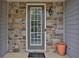 Townhouse front entry with stone accents and a glass door at 5820 Keystone Pt, Lithonia, GA 30058