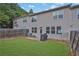 Fenced backyard with patio and grill area at 5820 Keystone Pt, Lithonia, GA 30058
