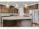 Open kitchen with a large island and granite countertops at 5820 Keystone Pt, Lithonia, GA 30058