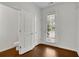Bright foyer with hardwood floors, powder room, and coat closet at 5820 Keystone Pt, Lithonia, GA 30058