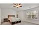 Main bedroom with a ceiling fan and large window at 5820 Keystone Pt, Lithonia, GA 30058