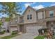 Two-story townhome with two-car garage and landscaping at 5820 Keystone Pt, Lithonia, GA 30058