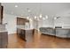 Spacious kitchen with an island, stainless steel appliances, and dark brown cabinets at 5820 Keystone Pt, Lithonia, GA 30058