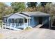 Charming blue house with covered porch and ramp at 6251 Pisgah Sw Rd, Mableton, GA 30126