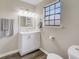 Renovated bathroom featuring a new vanity and toilet at 3745 Londonderry Ct, Stonecrest, GA 30038