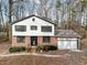 Two-story home with brick and white siding at 3745 Londonderry Ct, Stonecrest, GA 30038