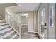 Renovated entryway with new flooring, staircase, and access to a back patio at 3745 Londonderry Ct, Stonecrest, GA 30038