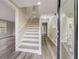 Modern entryway with a staircase, updated flooring and neutral color palette at 3745 Londonderry Ct, Stonecrest, GA 30038