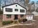 Two-story house, brick and white siding, attached garage at 3745 Londonderry Ct, Stonecrest, GA 30038