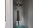 Clean bathroom with a modern vanity, glass sink, and updated light fixture at 20 Wisteria Blvd, Covington, GA 30016