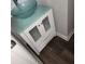 White vanity with glass top and two drawers, offering ample storage at 20 Wisteria Blvd, Covington, GA 30016