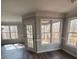 Bright dining area with wood-look floors, French doors, and windows offering wooded views at 20 Wisteria Blvd, Covington, GA 30016