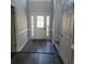 Bright entryway with new flooring, featuring a white door and sidelights at 20 Wisteria Blvd, Covington, GA 30016