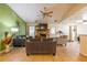 Living room with green accent wall, fireplace, and hardwood floors at 7845 Chase Woods Dr, Jonesboro, GA 30236