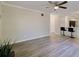 Open living room with kitchen bar and wood-look flooring at 1399 Cutters Mill Dr, Lithonia, GA 30058