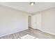 Bright bedroom with double door closet and wood-look floors at 1399 Cutters Mill Dr, Lithonia, GA 30058