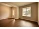 Bright entryway with wood-look floors, neutral walls, and natural light at 911 Park Place St, Social Circle, GA 30025