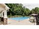 Community pool with lounge chairs and a covered patio area at 1013 Galloway Ridge Ct, Lawrenceville, GA 30045