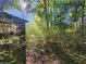 Wooded backyard with overgrown shrubs and trees at 2281 Carr Ne Rd, Conyers, GA 30012