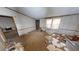Living room with carpeted floor and scattered items at 2281 Carr Ne Rd, Conyers, GA 30012