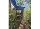 Screened porch with wooden steps and surrounding woods at 2281 Carr Ne Rd, Conyers, GA 30012