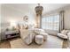 Spacious bedroom with large windows, plush bedding, and stylish accents at 100 Grand Cres, Alpharetta, GA 30009