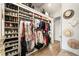 Spacious closet with custom built-ins and shoe storage at 100 Grand Cres, Alpharetta, GA 30009