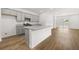 Kitchen boasts granite countertops, gray cabinets, and an island at 1877 Holmsey Cir, Conyers, GA 30094